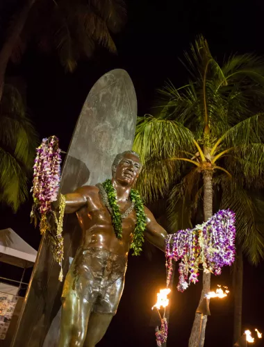 Statue of Duke Kahanamoku, father of modern surfing, on Kuhio Beach, Waikiki