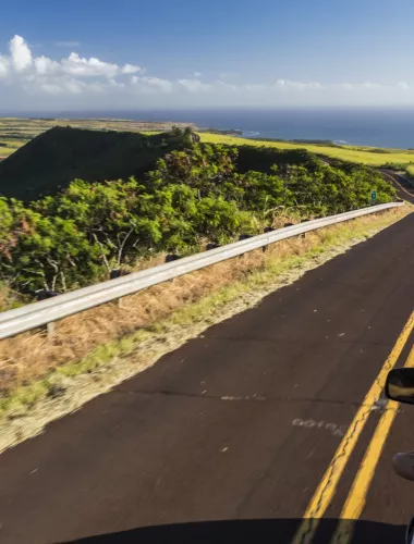 Car driving down the Holo Holo Koloa Scenic Byway