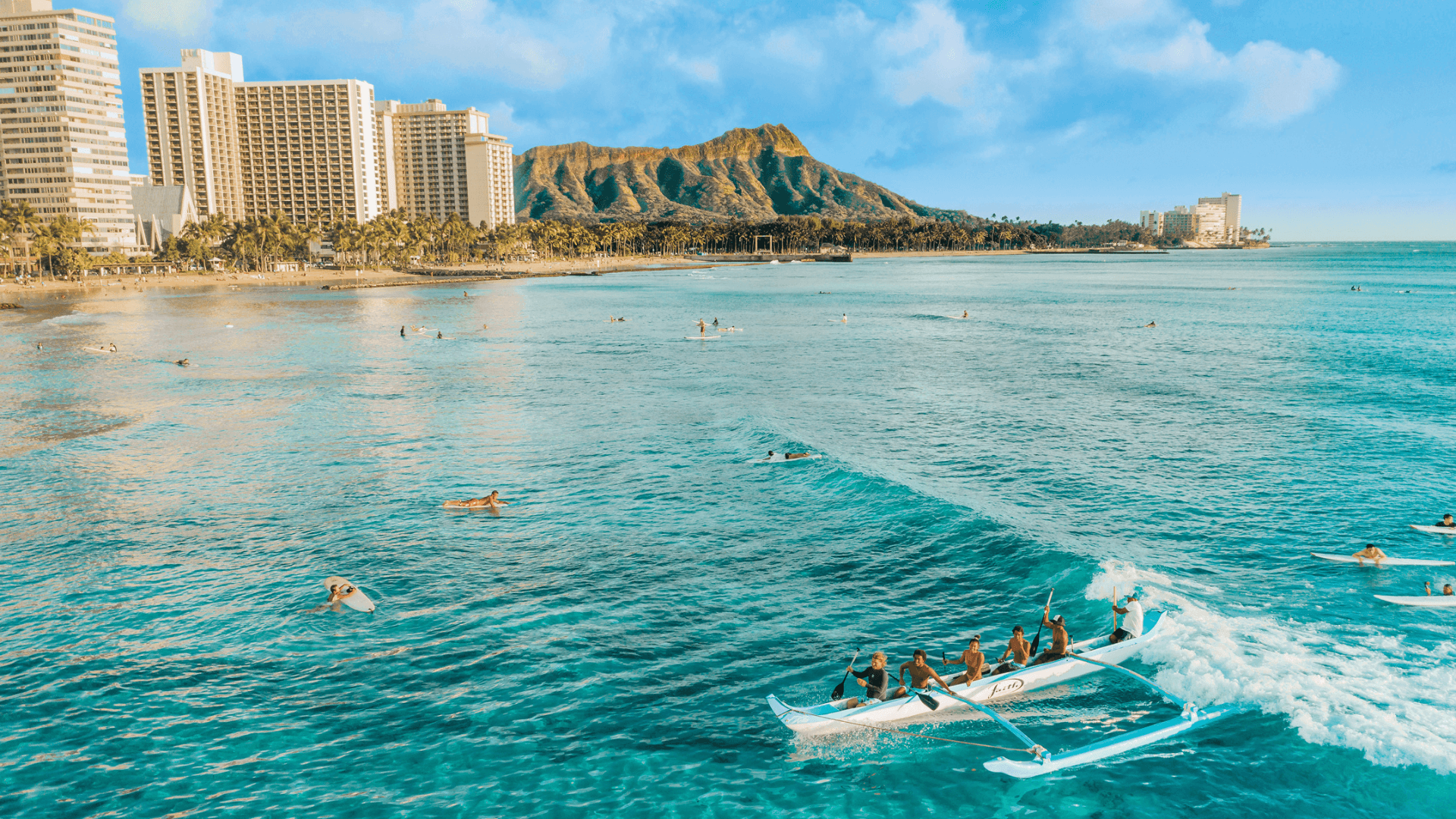 Catching a wave on an outrigger canoe Catching a wave on an outrigger canoe