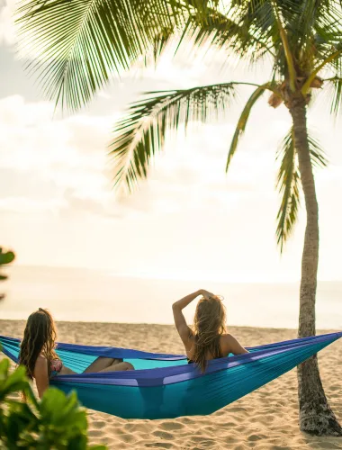 Women in a hammock at Hulopoʻe Beach Park on Lānaʻi in Hawaiʻi