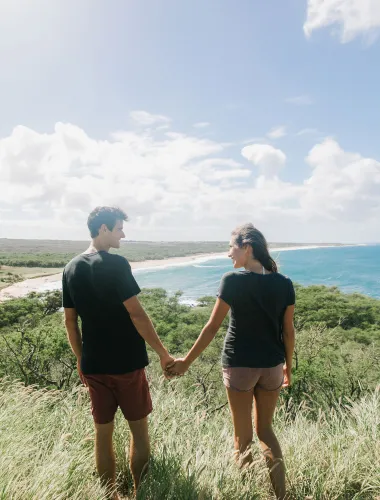 Couple overlooking a Kapukahehu Beach on Molokaʻi in Hawaiʻi