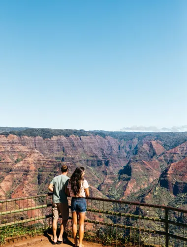 Travelers at the Waimea Canyon Lookout on Kauaʻi in Hawaiʻi