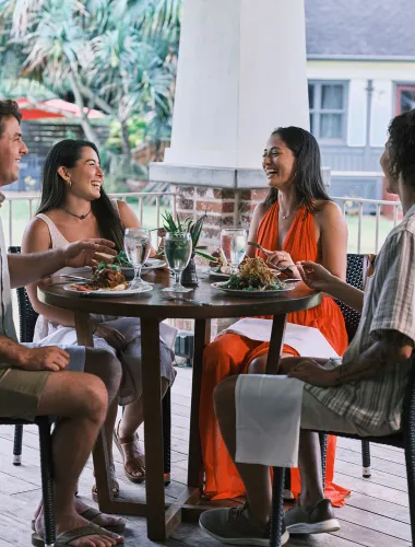 Visitors enjoying dinner at The Plantation House by Gaylords located in the historic Kilohana Plantation Estate.