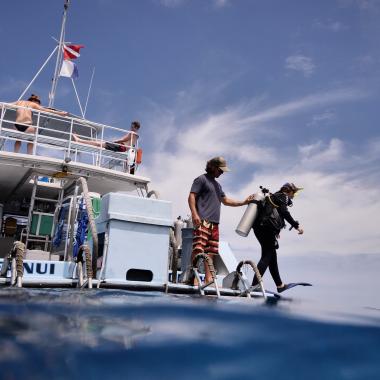 Slip into the clear waters of Kona, Hawaii from a Jack's Diving Locker boat.