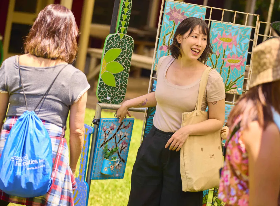 A visitor enjoys a mosaics booth during the festival.