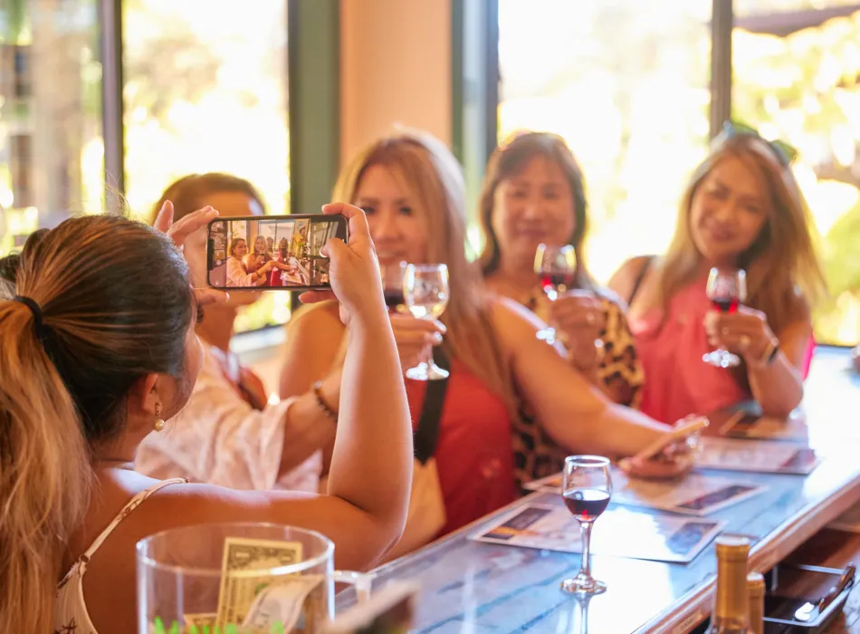 A group of friends strike a pose at Volcano Winery during the Experience Volcano festival.