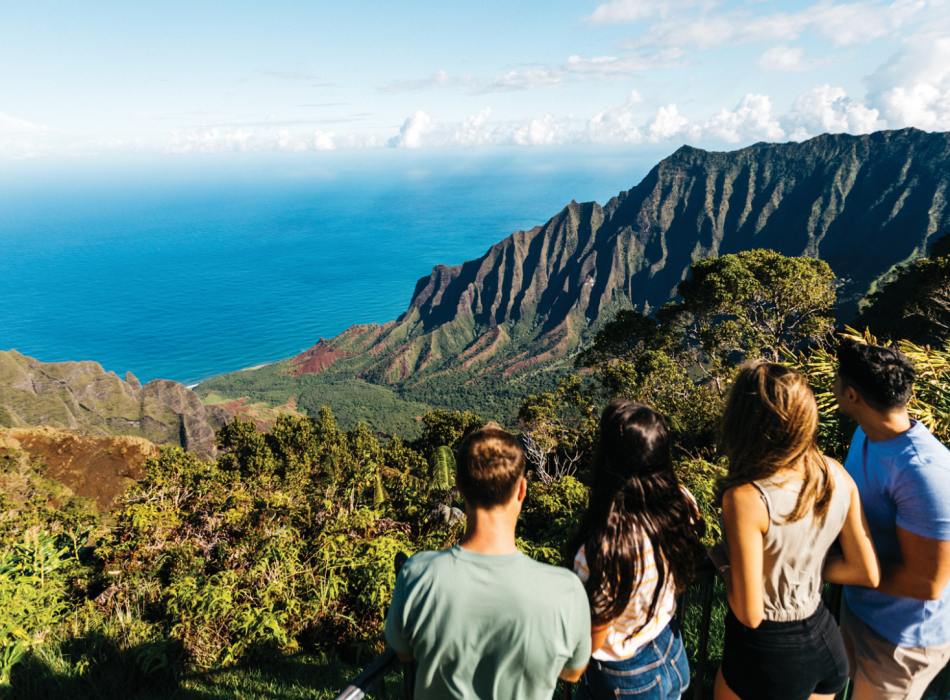 People enjoy the breathtaking view from Kalalau Lookout