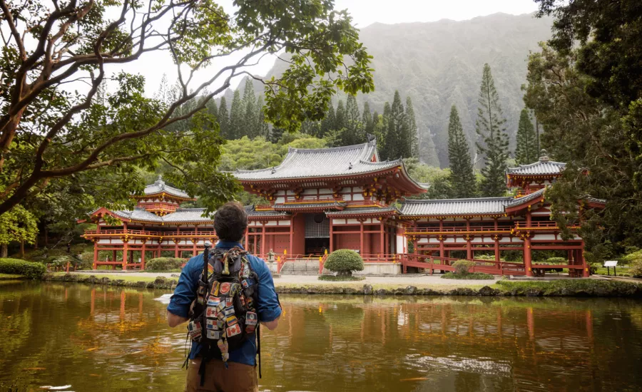 Man looking at a Japanese temple