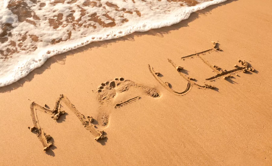 Maui written in the sand