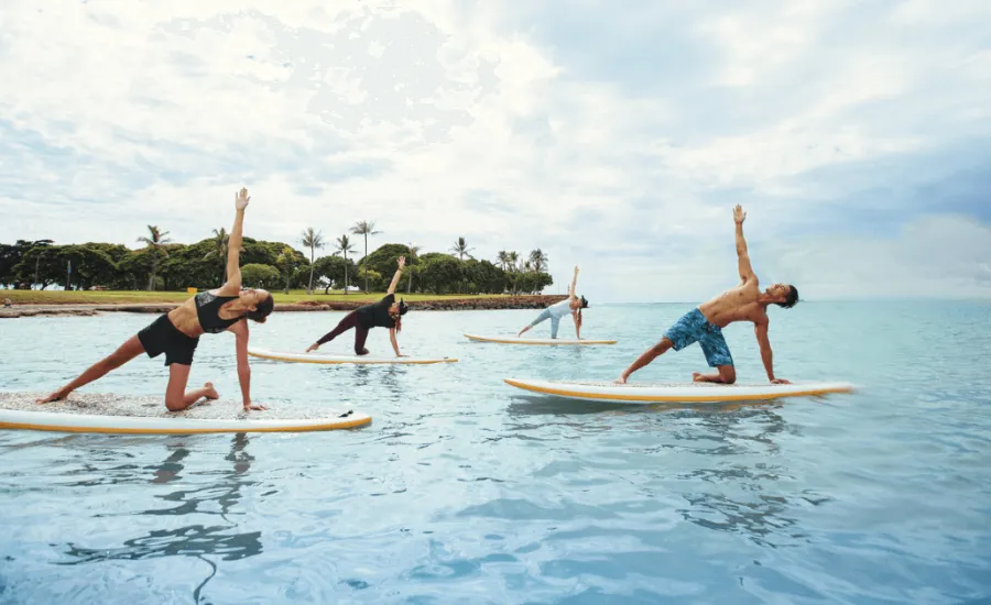 Stand up paddleboard yoga class at Ala Moana Beach