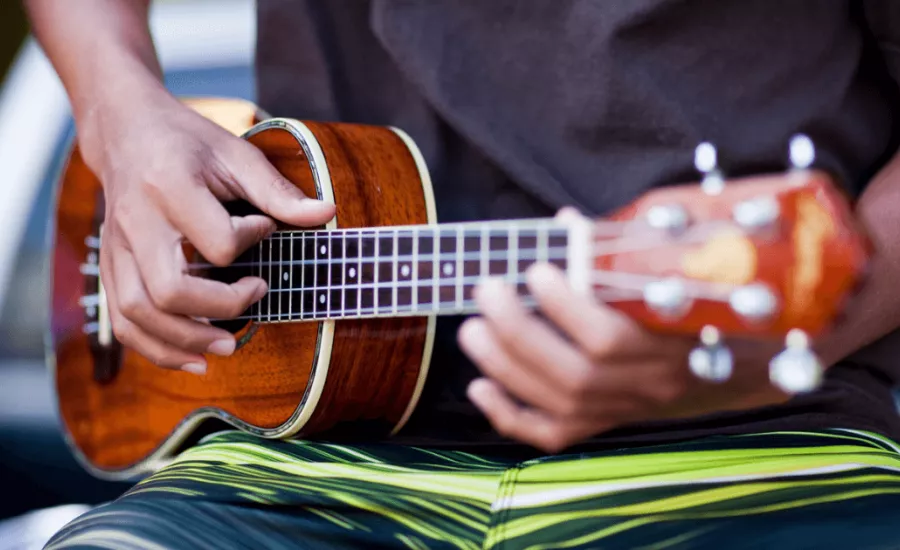 Man plays ukulele
