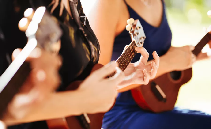 People play ukulele during a lesson