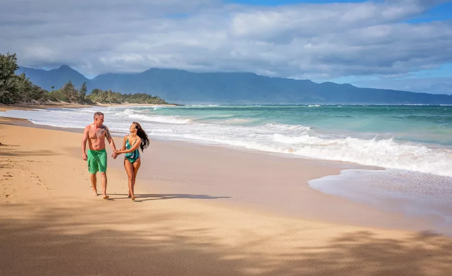  Couple walking on Baldwin Beach Maui