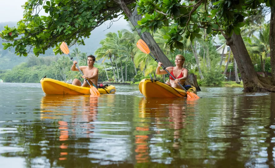 Man and woman kayaking on Kauai