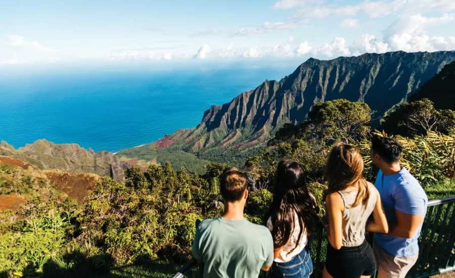 People enjoy the breathtaking view from Kalalau Lookout