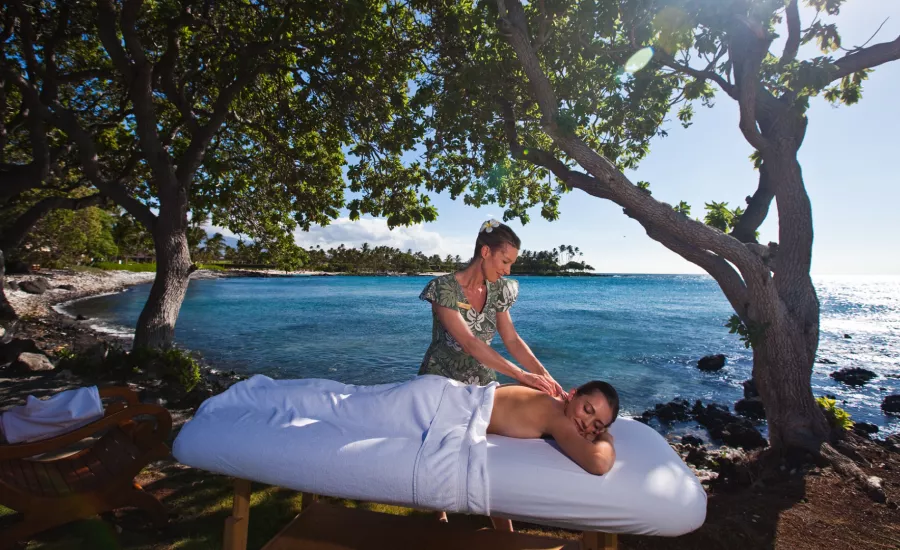 Woman receives massage near beach