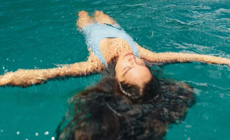 Woman floats off the Napali Coast