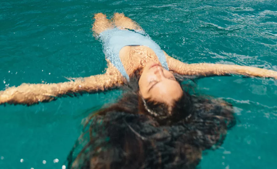 Woman floats off the Napali Coast